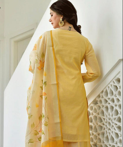 yellow knot-style kurta and Plazoo-Set adorned with a captivating floral-printed Dupatta.