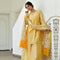 yellow knot-style kurta and Plazoo-Set adorned with a captivating floral-printed Dupatta.