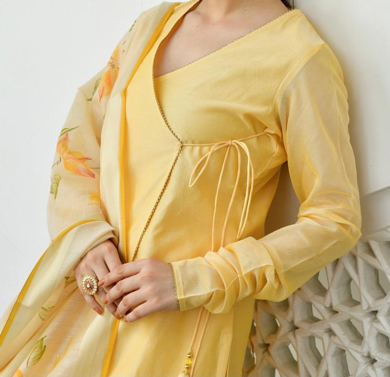 yellow knot-style kurta and Plazoo-Set adorned with a captivating floral-printed Dupatta.