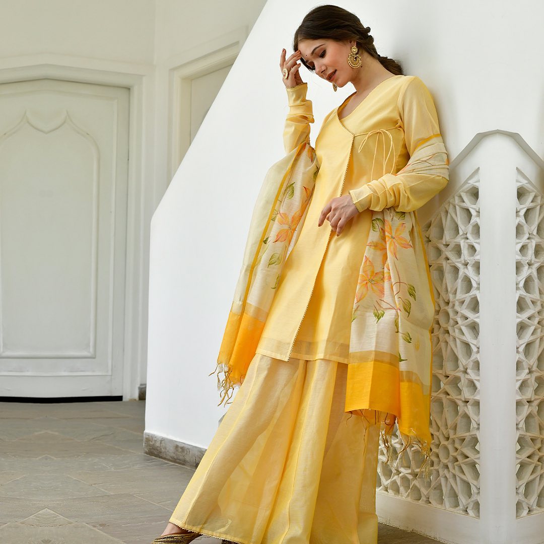 yellow knot-style kurta and Plazoo-Set adorned with a captivating floral-printed Dupatta.