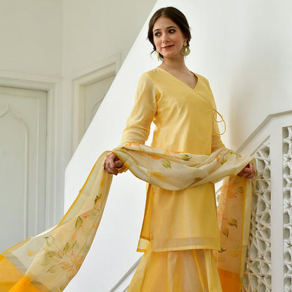 yellow knot-style kurta and Plazoo-Set adorned with a captivating floral-printed Dupatta.